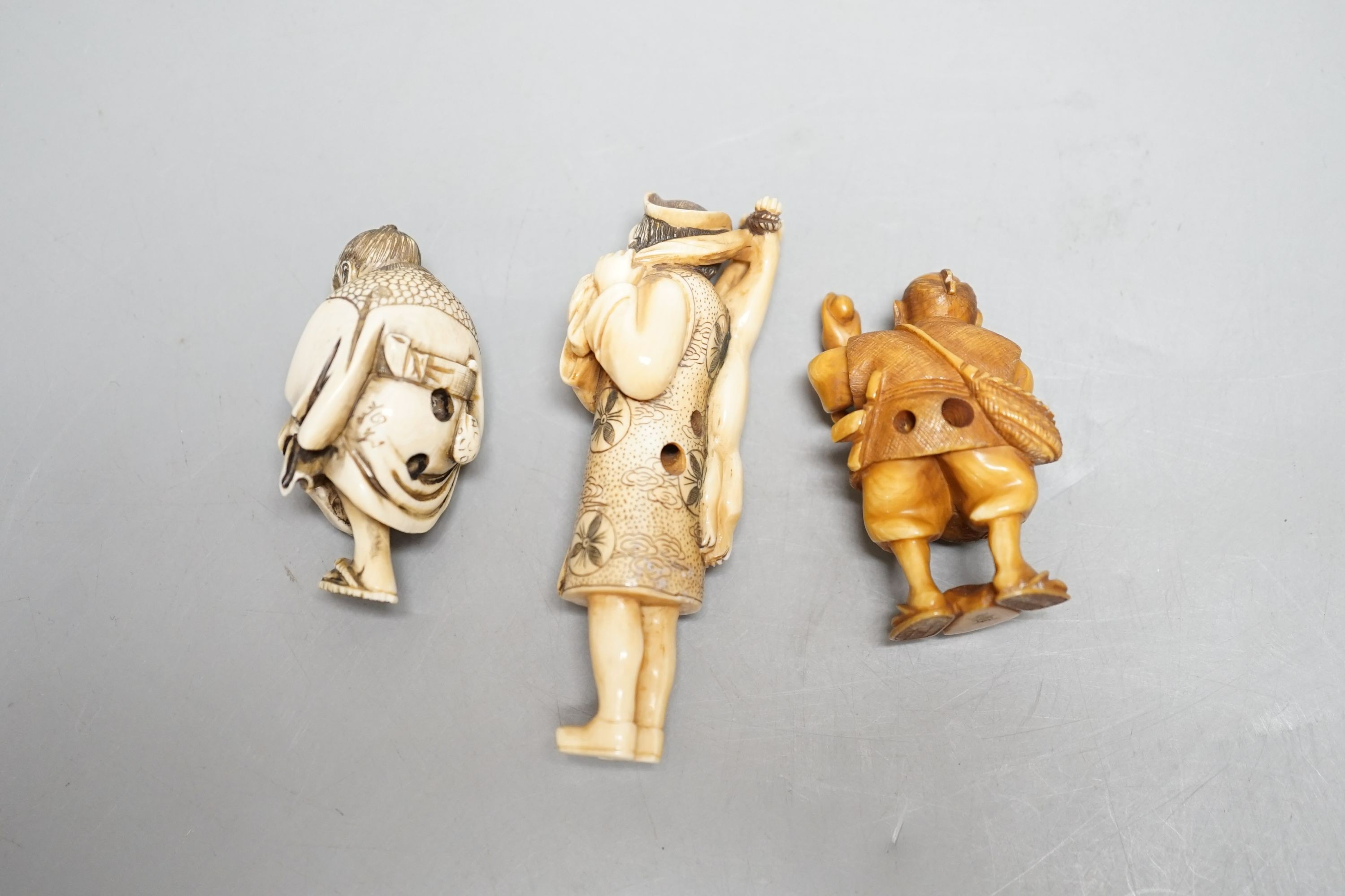 Three Japanese ivory netsuke of men, Taisho/early Showa period, signed - tallest 8cm